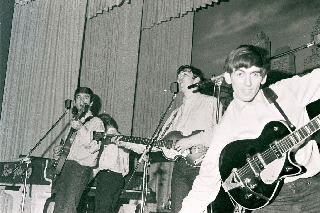 John Lennon, Paul McCartney and George Harrison perform at the Star-Club in Hamburg, Germany, in May 1962