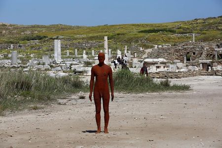 The statue "Another time V," part of British sculptor Antony Gormley's exhibiton "Sight," is displayed on the Greek island of Delos, a UNESCO World Heritage protected ancient archaeological site.