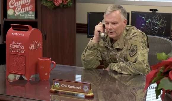 Gen. Glen VanHerck, Commander of North American Aerospace Defense Command and U.S. Northern Command talks on the phone as part of a video celebrating the NORAD Santa Tracker's 65th year.