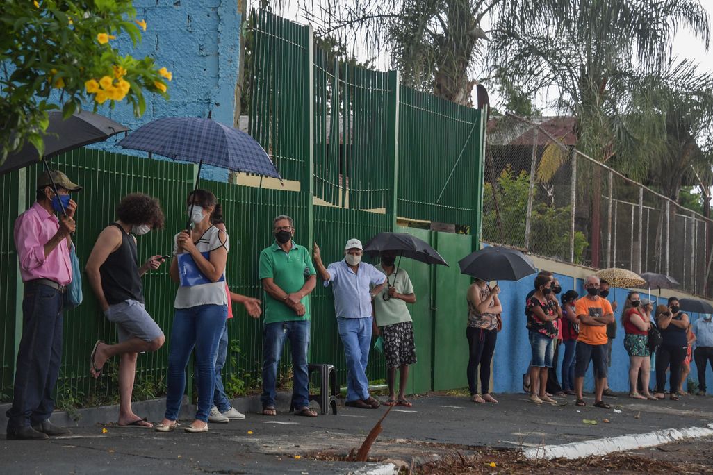 On February 17, 2021, residents line up to receive the Coronavac vaccine against COVID-19, in Serrana, about 323 km from Sao Paulo, Brazil.