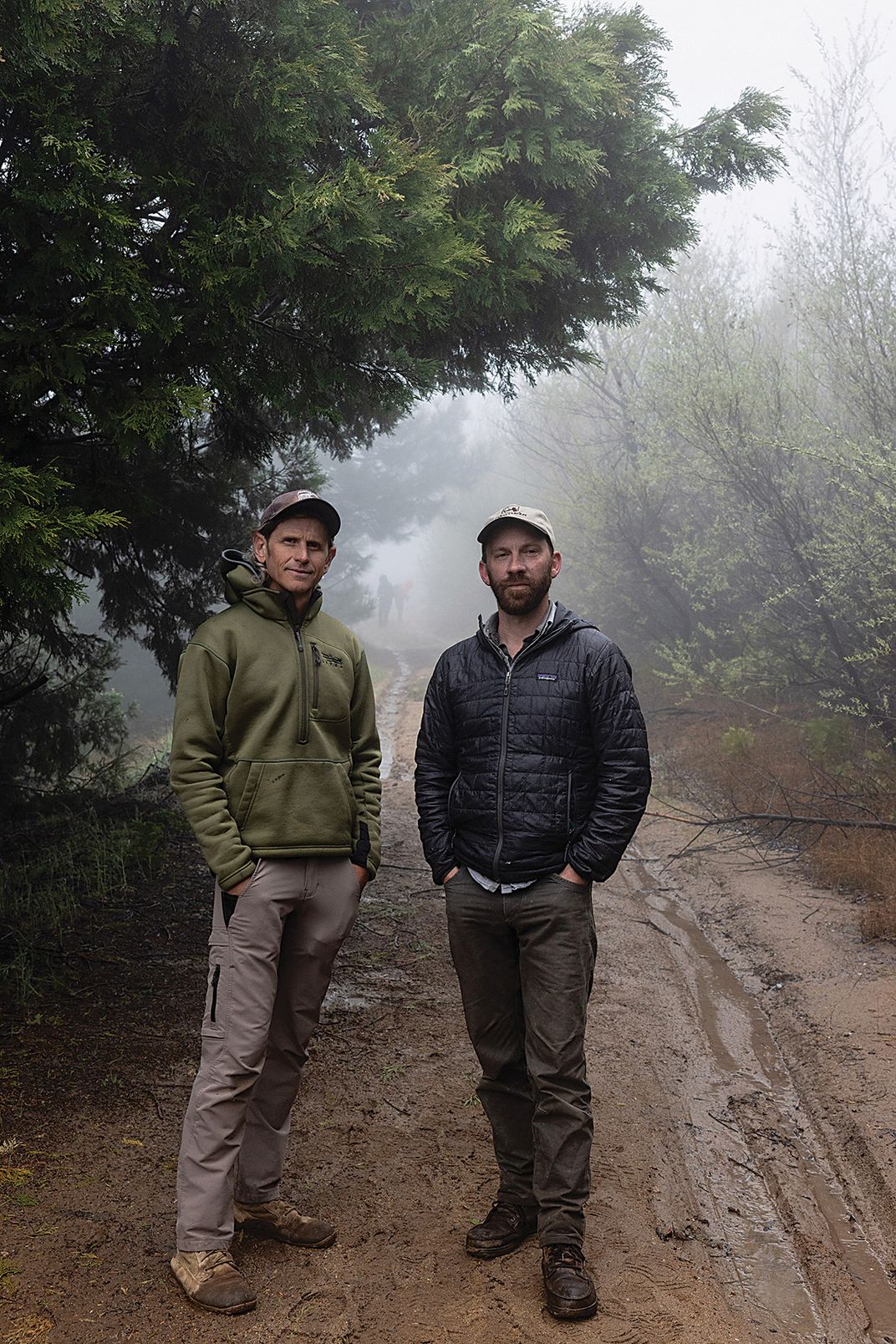 two men stand for a portrait