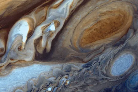 Assembled and enhanced from three Voyager 1 negatives, this picture shows Jupiter’s swirling clouds and Great Red Spot.