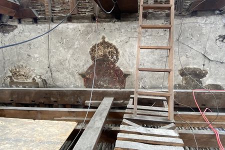 Found by workers during recent restorations, the wall paintings feature three crowned motifs.
