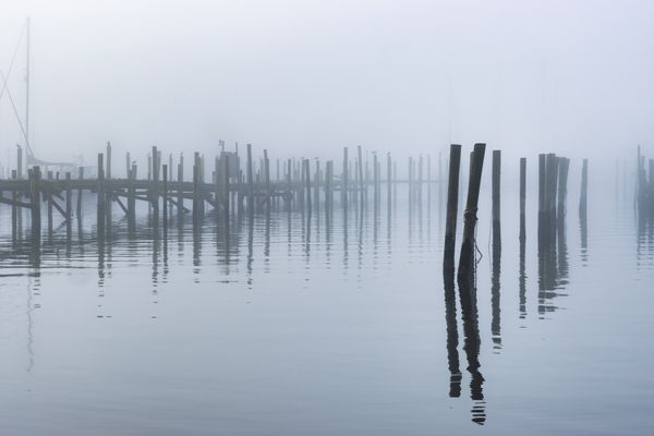 Old piers receding in the mist thumbnail