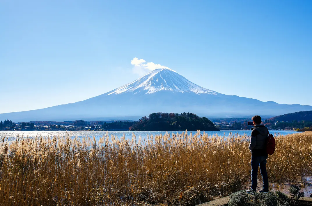 Hiker viewing Mt. Fuji from Lake Kawaguchiko