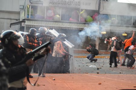 Tear gas being used on protesters in Caracas in February. 