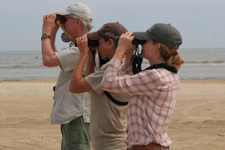 In the new book North on the Wing from Smithsonian Books, author Bruce Beehler (above left) follows the spring migration of songbirds.