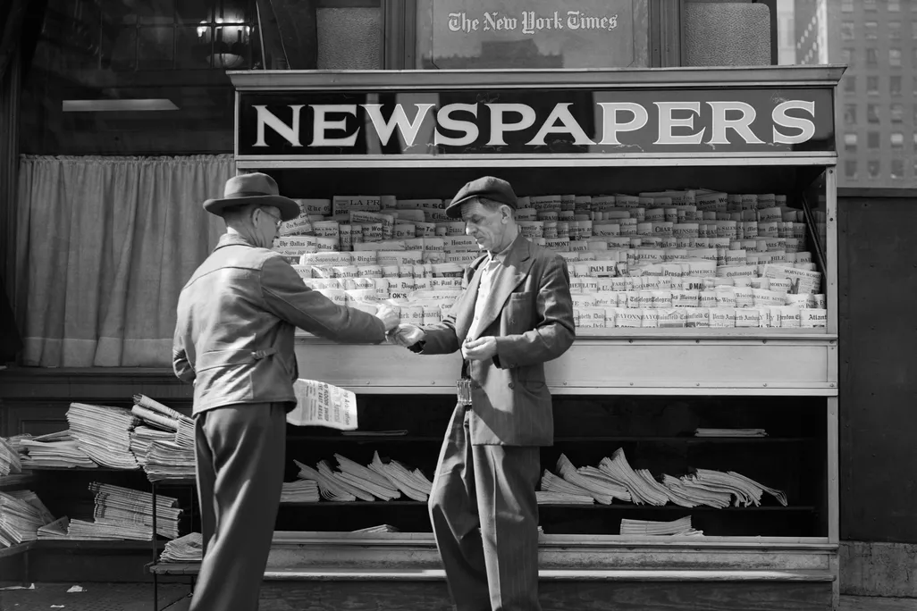 Man buying newspaper in NYC