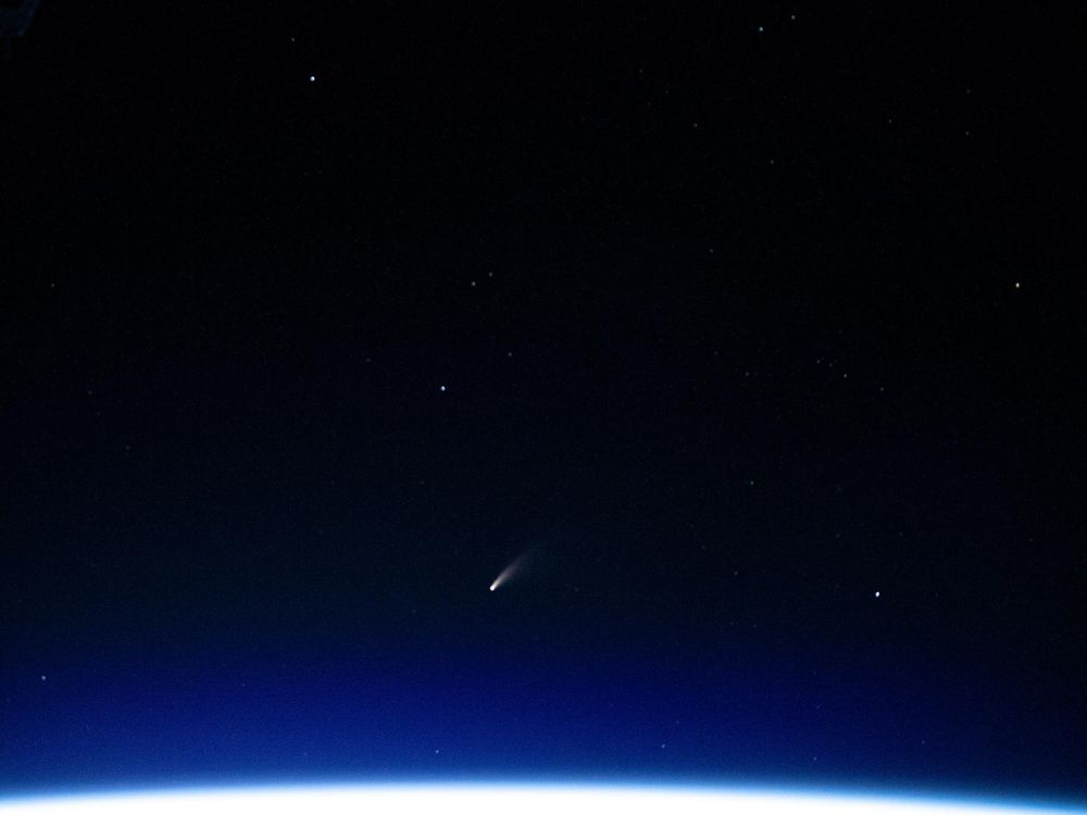 A photograph shows the NEOWISE comet in the night sky