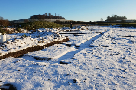 Snow-covered outline of the Roman villa's foundations