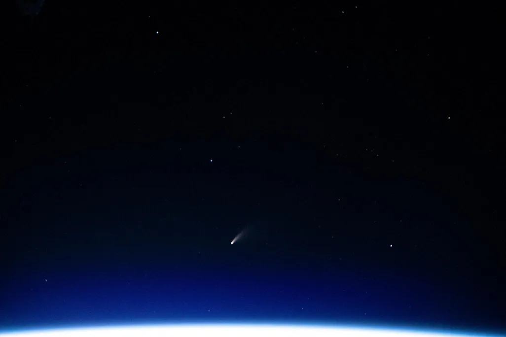 A photograph shows the NEOWISE comet in the night sky