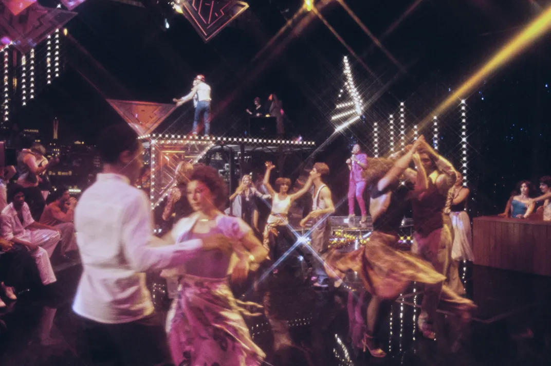 Clubbers on the dance floor in an nightclub, circa 1975