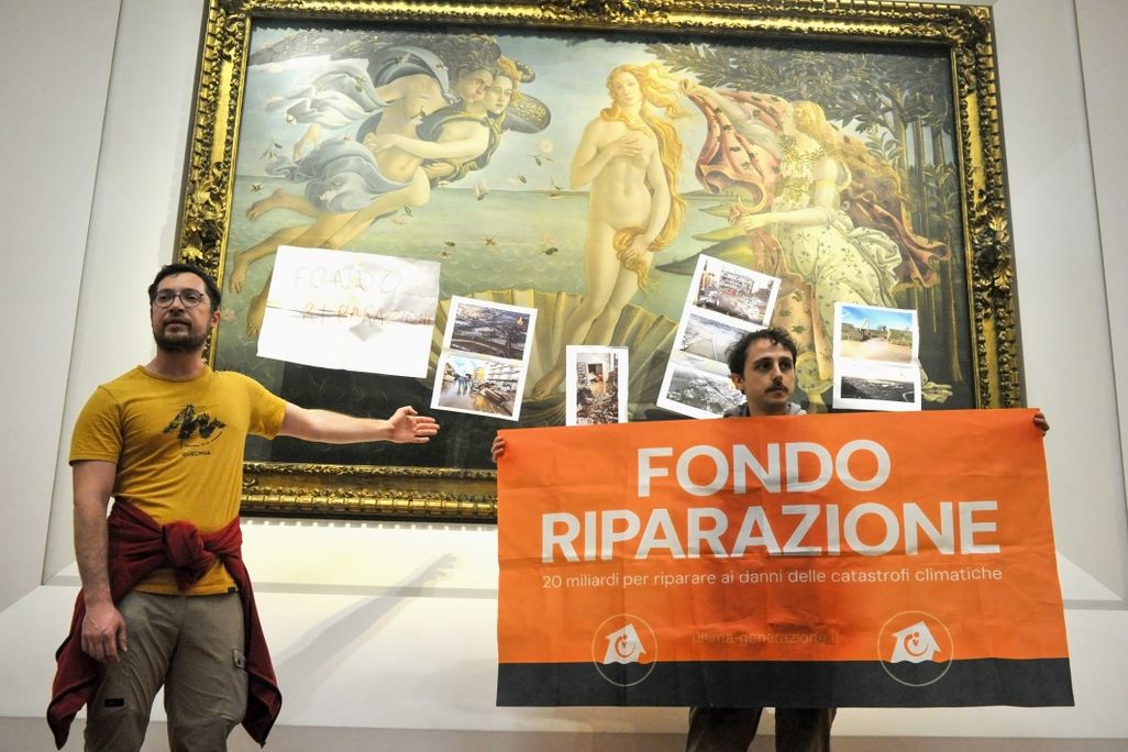 Protesters in front of painting