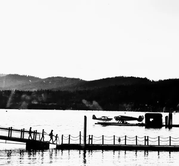 In Silhouette a Family Arrives For a Seaplane Ride thumbnail