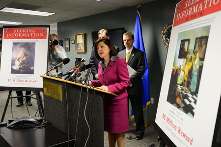 United States Attorney Carmen Ortiz (C) along with Special Agent-in-Charge of the FBI's Boston Field Office Richard Des Lauriers (R) announce investigative developments in the 1990 art heist at the Isabella Stuart Gardner Museum and appeal to the public for information regarding the return of several pieces during a news conference at the FBI offices in Boston, Massachusetts