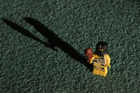 Lego Caveman comes armed with a toy wooden club.