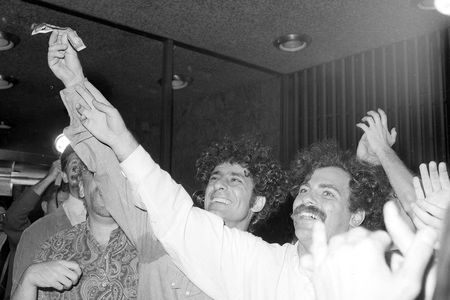 Political activists Abbie Hoffman, left, and Jerry Rubin set five-dollar bills on fire at the Financial Center in New York on August 24, 1967.