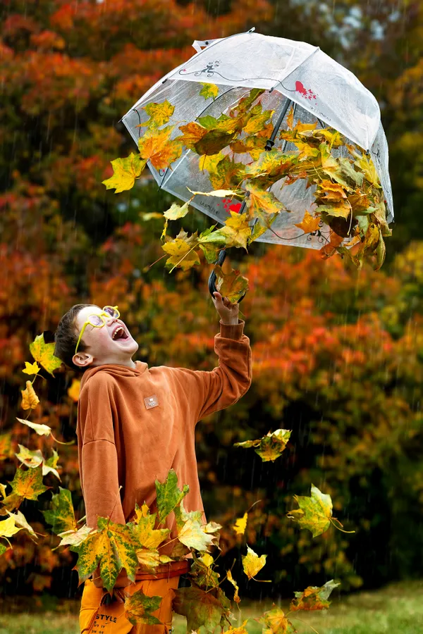 Happy boy in the rain thumbnail