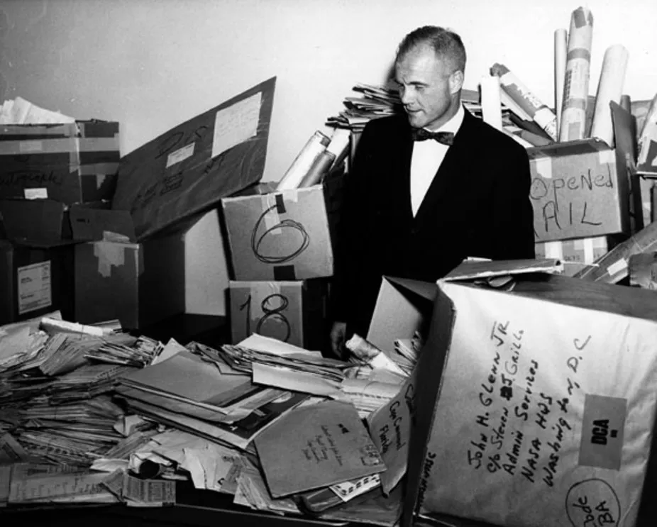 John Glenn stands in the NASA mailroom