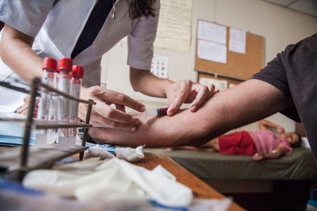 A doctor and patients in Nicaragua during an outbreak of dengue and chikugunya virus earlier in 2015
