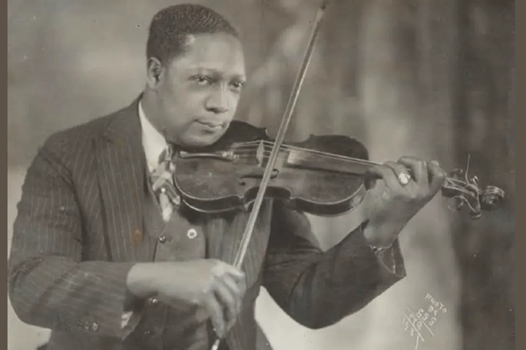 Photographer James Van Der Zee playing violin