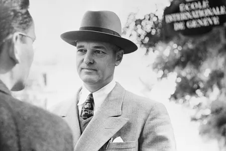 U.S. Ambassador to Russia, George F. Kennan, chats with a newsman after the Russian government told the U.S. State Department that Kennan must be recalled immediately. The Russians charged that the ambassador made completely false statements hostile to the Soviet Union. At the time, Russia demanded his recall (three days ago) Kennan was in Geneva, where he'd been visiting his daughter who is a student at the International School. U.S. Secretary of State Dean Acheson called the Russian charges, outrageous.