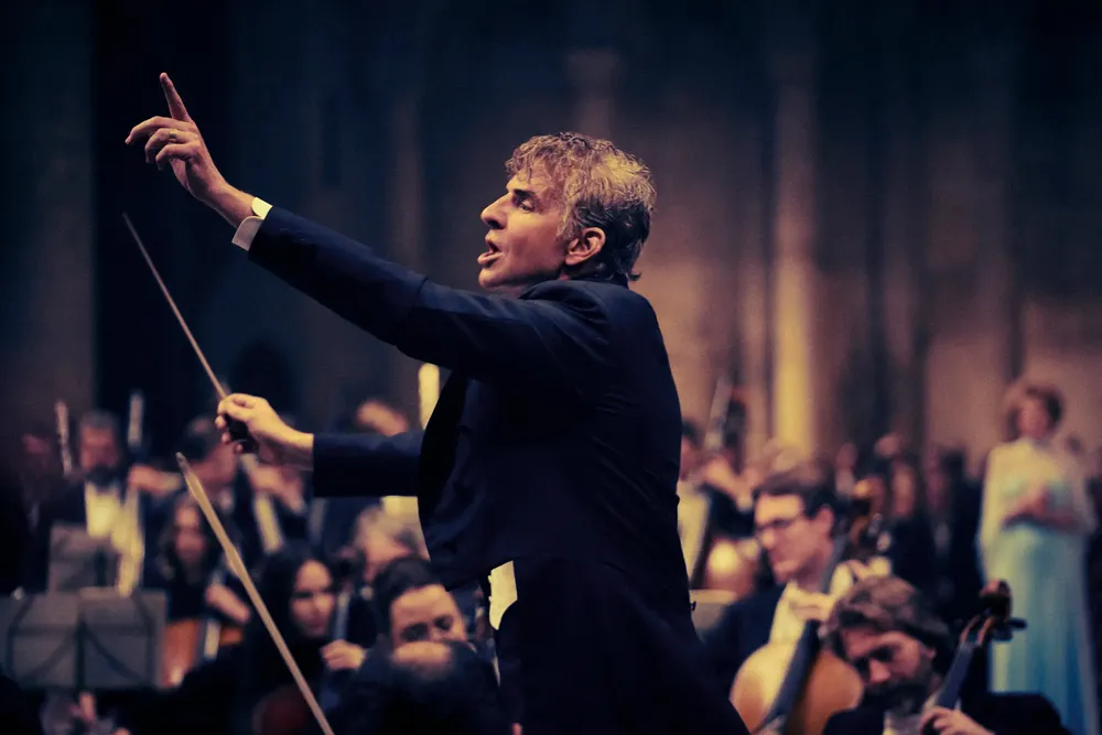 Bradley Cooper as Leonard Bernstein, conducting