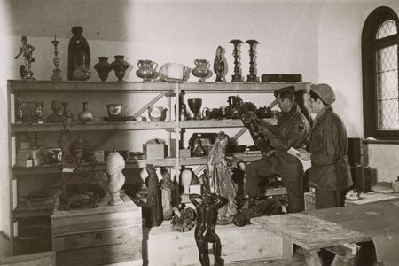 American soldiers sift through art looted by the Nazis at Neuschwanstein Castle in 1945