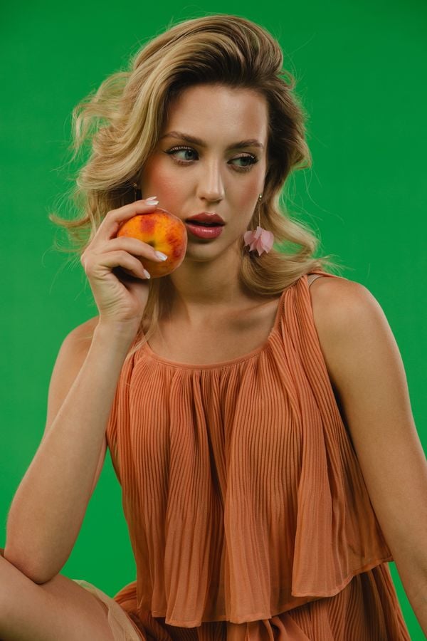 Girl with peach thumbnail