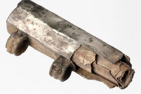 The silver amulet contained a thin foil scroll.