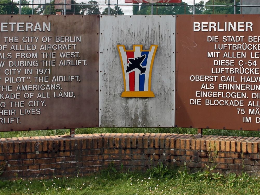 Two rectangular Stone Monuments side by side outlining story of Candy Bomber