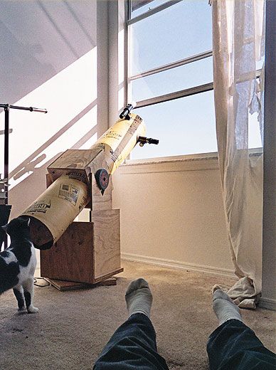 Still life with telescope, feline, and feet. Even the National Air and Space Museum uses a Dobsonian telescope to show visitors the sun.