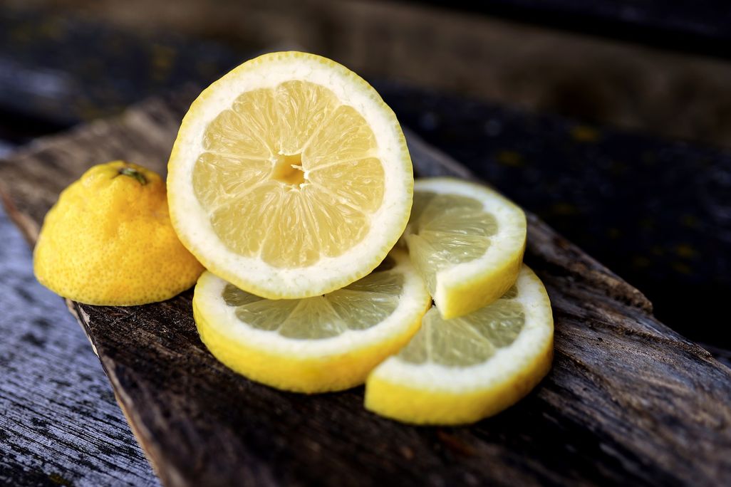 Lemon half and slices on a table