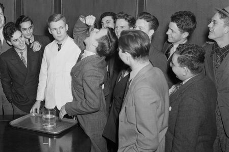 On March 3, 1939, Harvard freshman Lothrop Withington, Jr., swallows a, live, squirming goldfish to win a ten dollar bet. He reportedly practiced the feat for days before by swallowing baby goldfish and tadpoles.