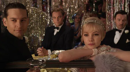 (L-R) Tobey Maguire as Nick Carraway, Leonardo DiCaprio as Jay Gatsby, Carey Mulligan as Daisy Buchanan and Joel Edgerton as Tom Buchanan in Warner Bros. Pictures' and Village Roadshow Pictures' drama "The Great Gatsby," a Warner Bros. Pictures release.