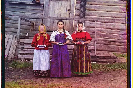 "Peasant girls." Young Russian women offer berries to visitors in a rural area along the Sheksna River near the small town of Kirillov.
