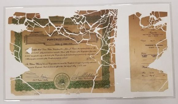 The stock certificate pieced back together and encased in mylar (NMAH)