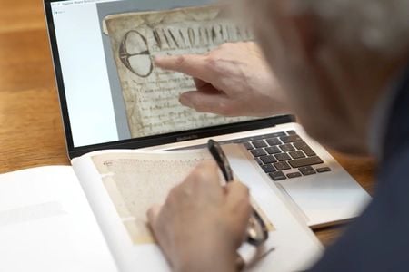 Historian David Carpenter examines the digitized document.