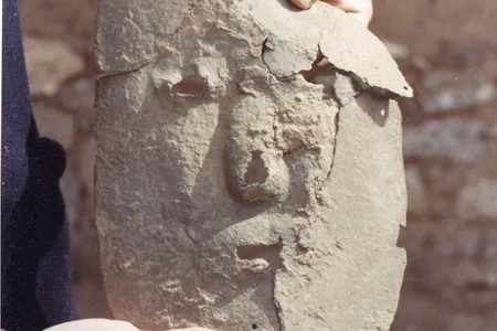 The mask being held by researcher Leticia Cortes the day of the discovery.
