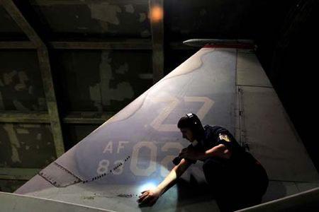 Airman 1st Class David Eckert conducts his pre-flight checks on an F-15 Eagle during an exercise March 23, 2010, at Kadena Air Base, Japan. He is a technical aviation mechanic with the 18th Aircraft Maintenance Squadron. (U.S. Air Force photo/Tech. Sgt. Rey Ramon)