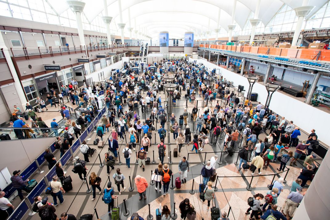 Travelers waiting in line at Denver airport security