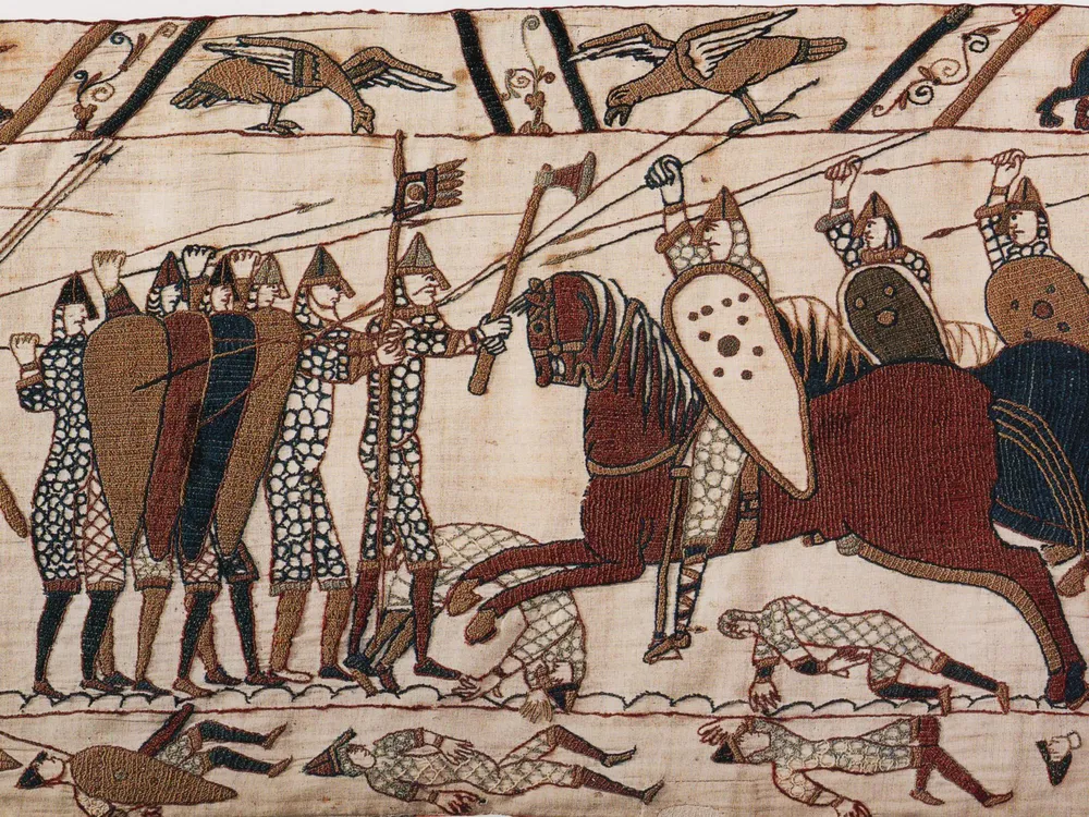 Part of scene 52 of the Bayeux Tapestry. This depicts mounted Normans attacking the Anglo-Saxon infantry.