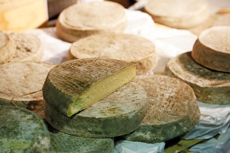 Despite aging in old volcanic caves, Saint-Nectaire cheese is rather sweet in aroma and flavor.