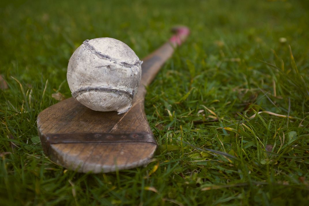 Racket and ball for the traditional game of hurling