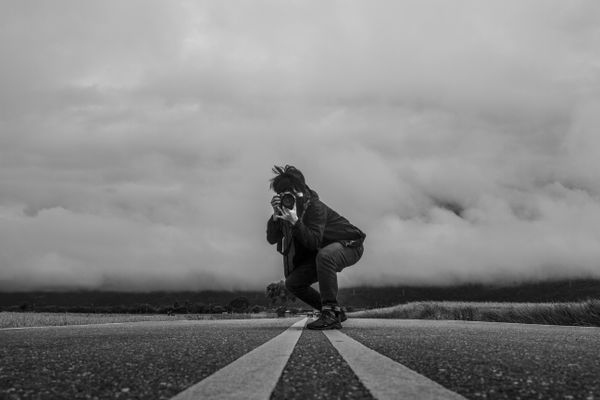 Photographer surfing in the clouds thumbnail