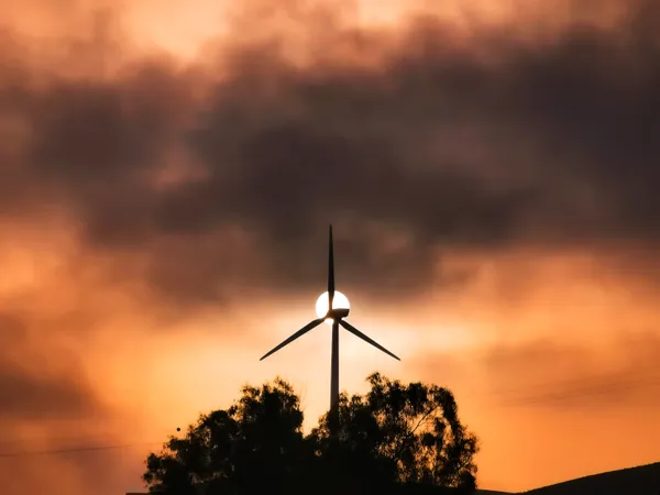 Wind Turbine Hugs the Sun thumbnail