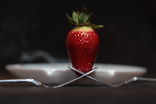 A strawberry waiting to be eaten thumbnail