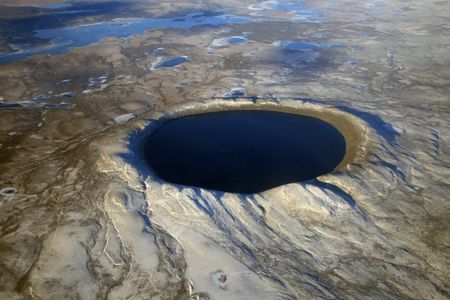 Pingualuit crater’s circular shape, obvious in a 2007 aerial photograph, has made the lake a navigational landmark. With its immense volume, it is slow to freeze and thaw.
