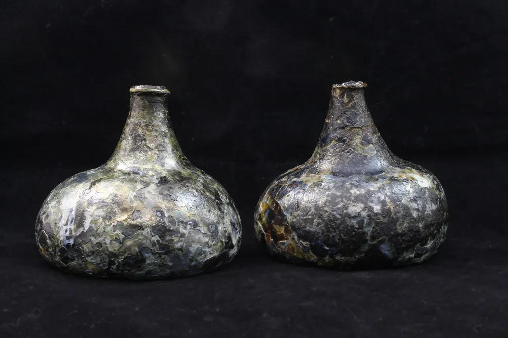 Bottles against a black backdrop