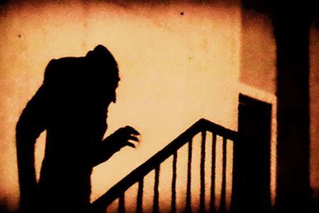 A shadowy scene from F. W. Murnau's Nosferatu (1922). 